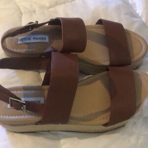Woman’s brown fall open toe Steve Madden espadrille platform sandals